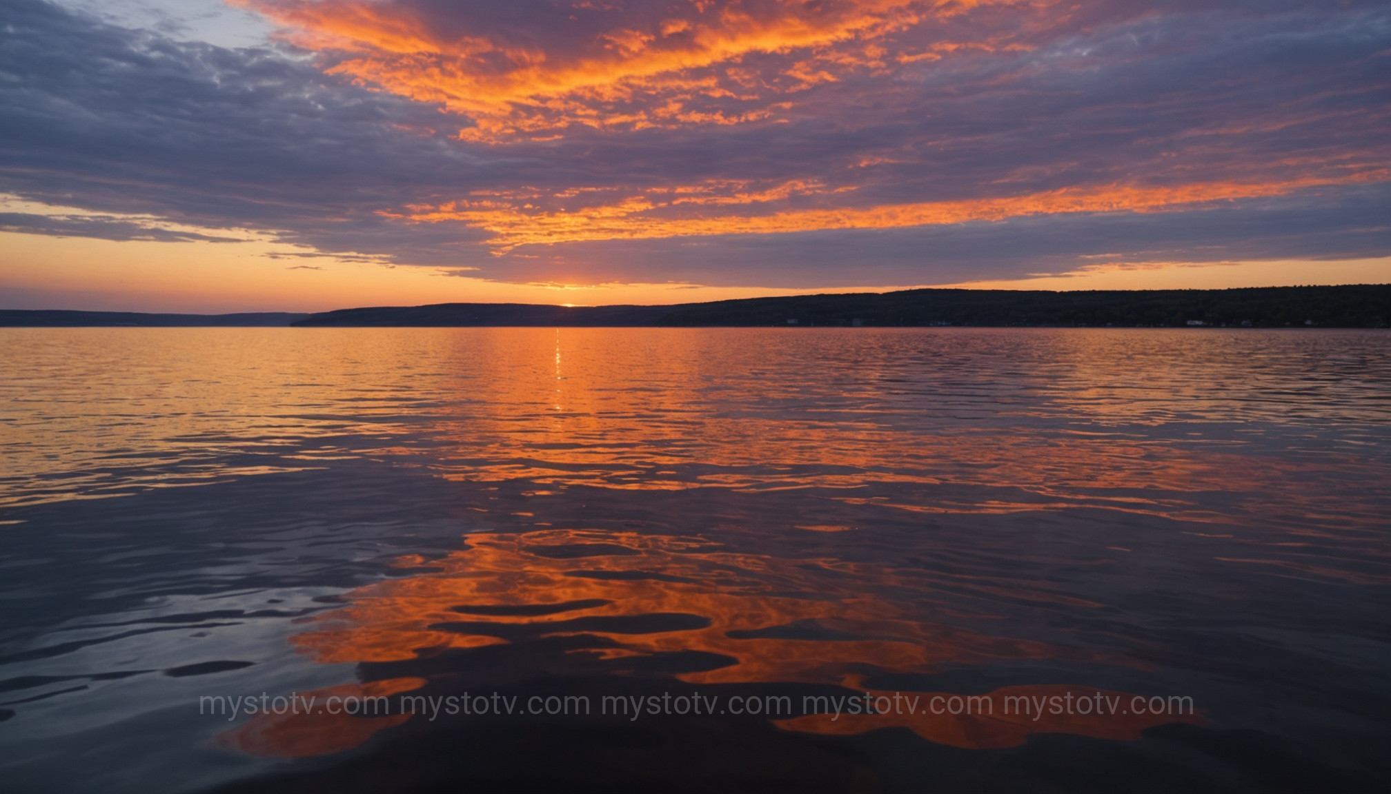 The tranquil sky over a lake where Skyquakes, a type of mysterious sounds unexplained, are frequently reported.